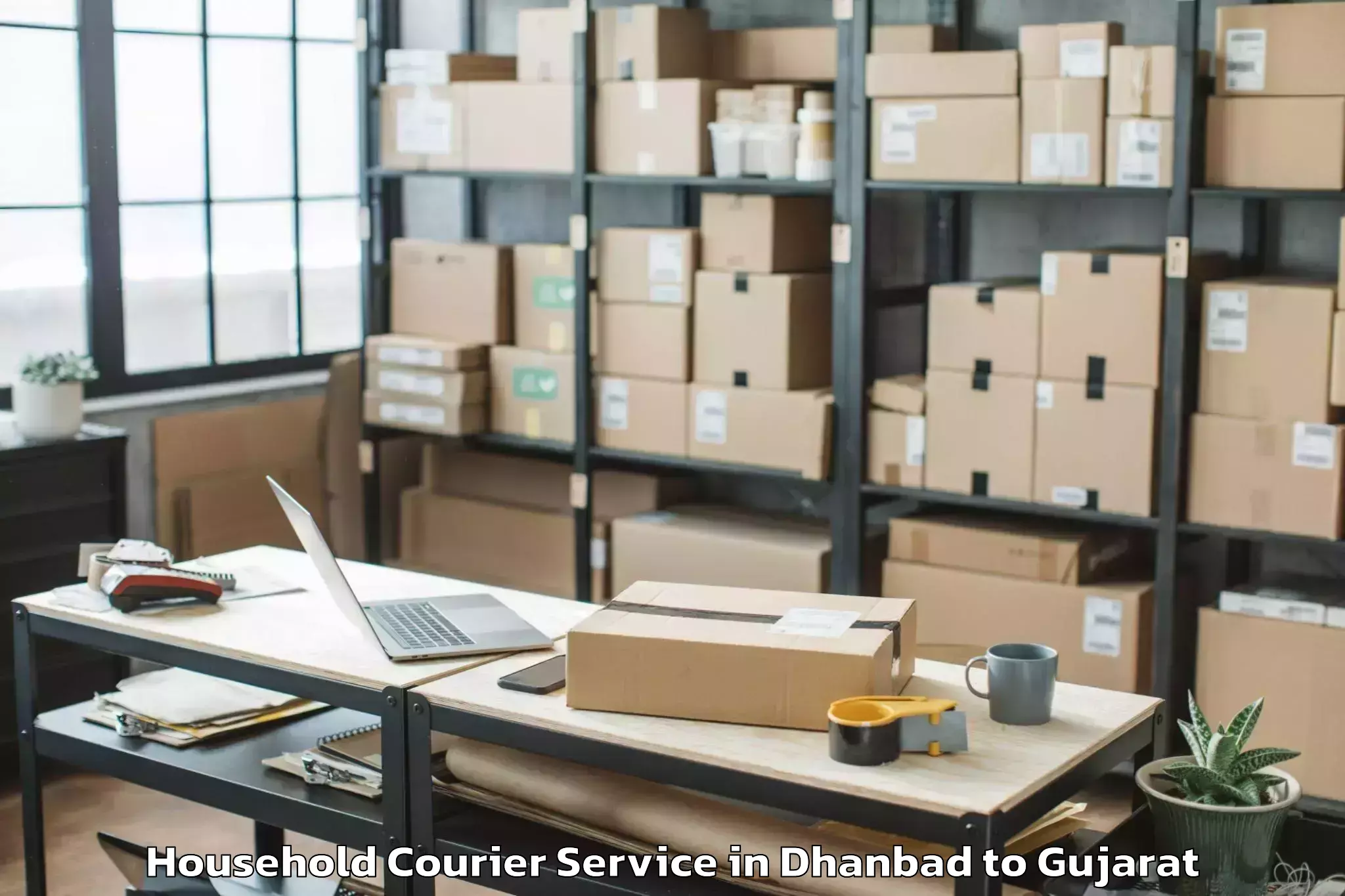 Reliable Dhanbad to Waghai Household Courier